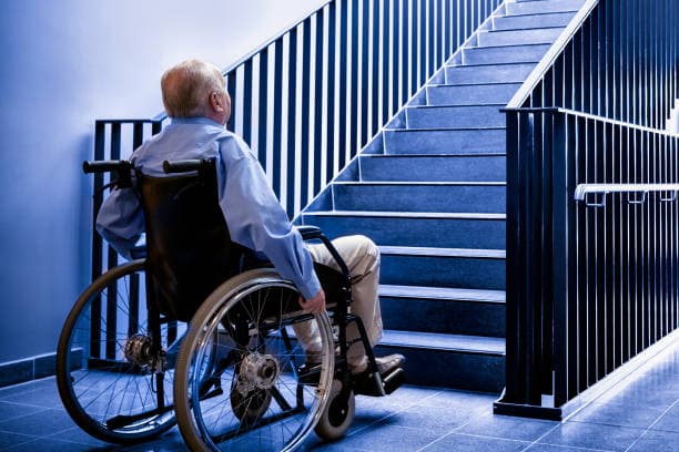 Elderly person using LiftMe home lift with family support